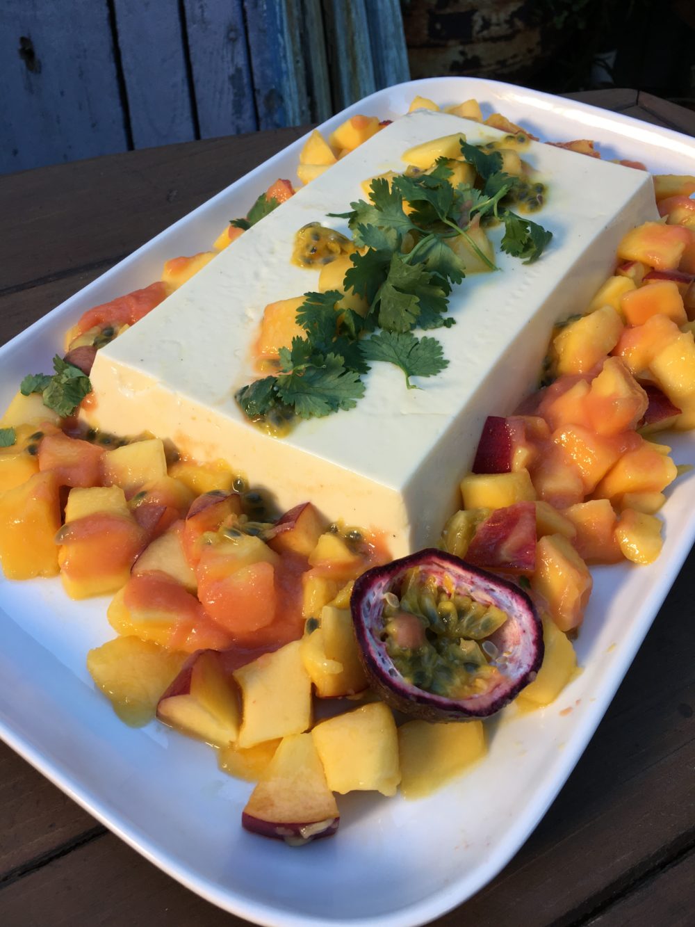 Cardamom Buttermilk Panna Cotta with Tropical Salad & Peach Coulis